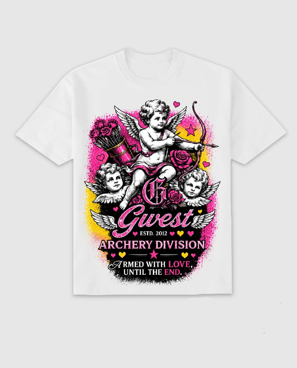 A white short-sleeve graphic T-shirt displayed on a light gray background, featuring a large Valentine's Day archery-themed print with cherubs, roses, and the text 'GUEST ARCHERY DIVISION.' A matching sneaker and small graphic badge appear at the bottom right.