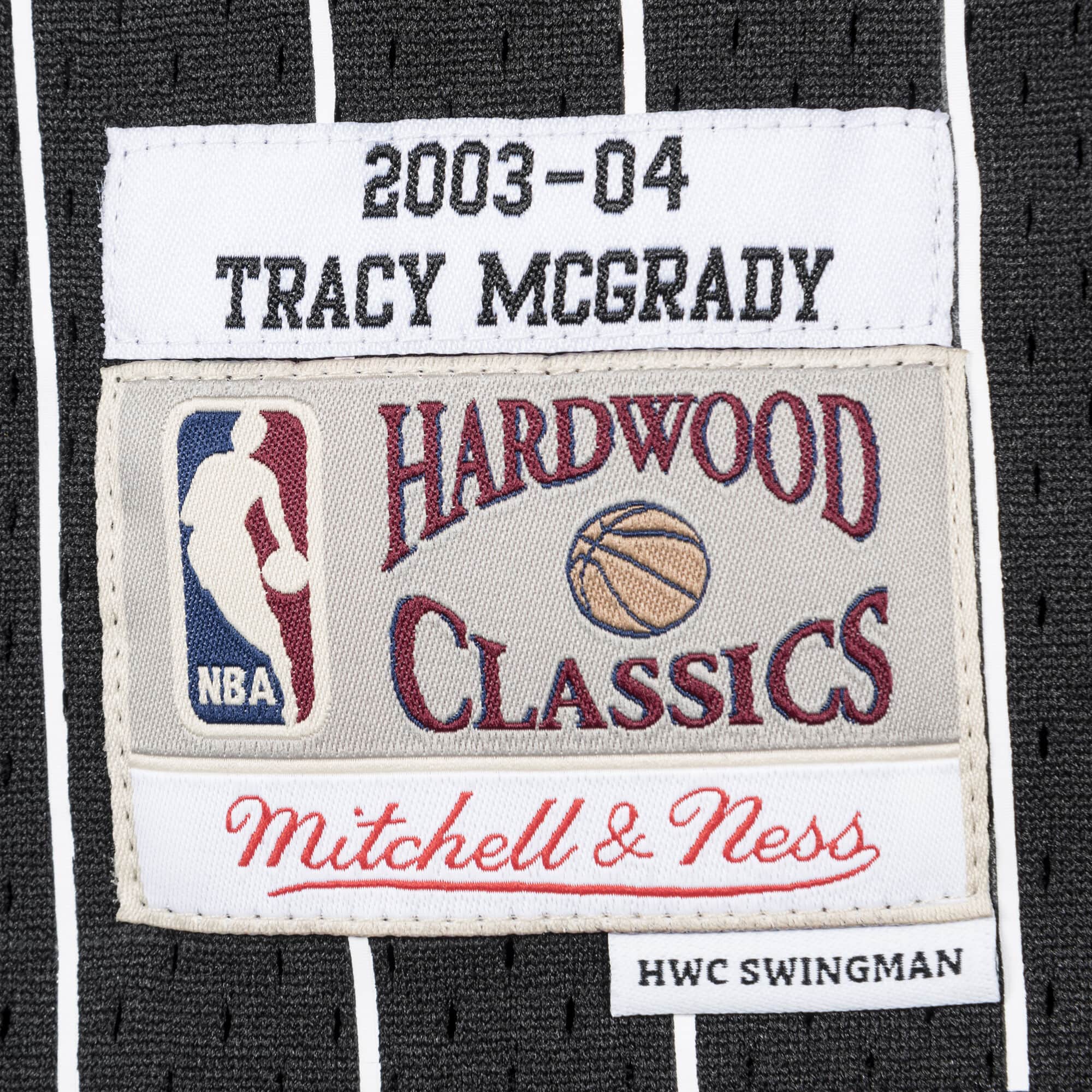mitchell-and-ness-swingman-tracy-mcgrady-orlando-magic-nba-2003-04-jersey-smjyac18098-omablck03tmc